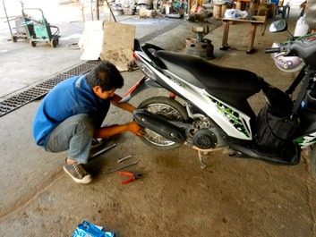 Good Shepherd Sisters - Chiang Rai fixing a bike tire
